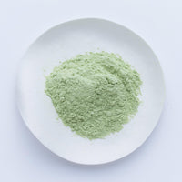 Ippodo Tea Uji-Shimizu sweetened matcha powder stone-ground green tea sprinkled on white plate