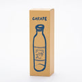 Brown tall narrow box for glass carafe with playful drawing of carafe on front, and CARAFE written in capital letters