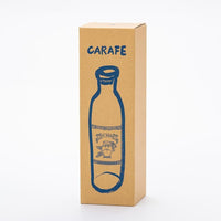 Brown tall narrow box for glass carafe with playful drawing of carafe on front, and CARAFE written in capital letters