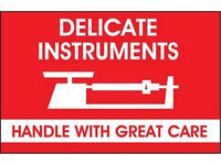 Red fragile sticker that says "delicate instruments - handle with great care" in white with picture of delicate machine