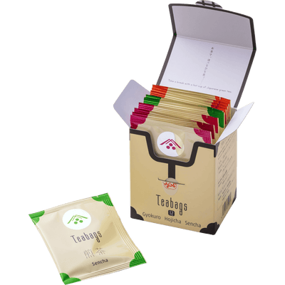 Box of assorted teabags with a single sencha teabag on a white background