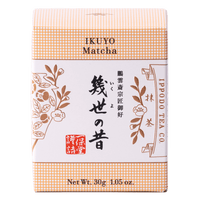 Unopened box of Ippodo Tea Co. Ikuyo matcha powder with peach color hashmarks, Japanese characters and gold flowers leaves