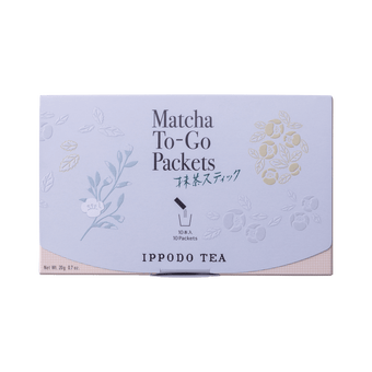 Slim peach color box of Matcha-To-Go Packets with light grey flap to open on front with faint multicolored flowers petals