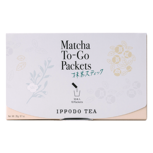 Slim peach color box of Matcha-To-Go Packets with light grey flap to open on front with faint multicolored flowers petals