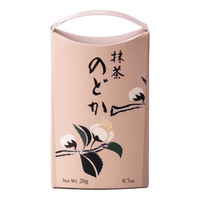 Unopened pale pink decorative box of Ippodo Tea Nodoka matcha with black Japanese characters and traditional white flowers
