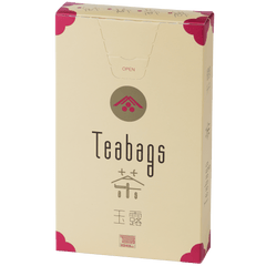 Sealed tall, cream box of 12 Ippodo Gyokuro One-Cup Teabags with pink corners and logo on bronze circle and easy open tab