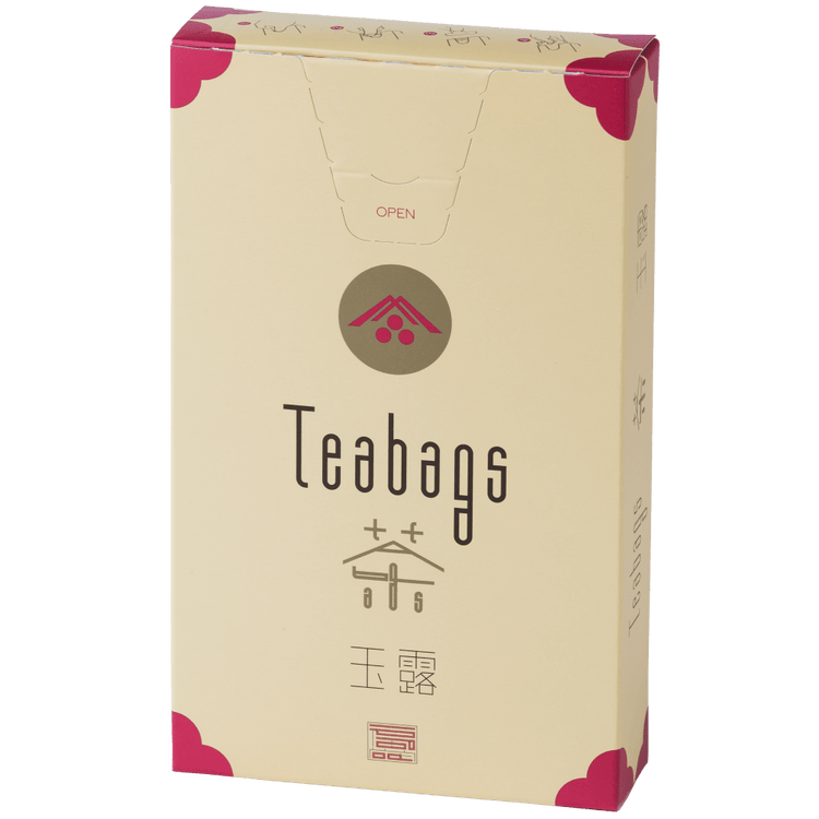 Sealed tall, cream box of 12 Ippodo Gyokuro One-Cup Teabags with pink corners and logo on bronze circle and easy open tab