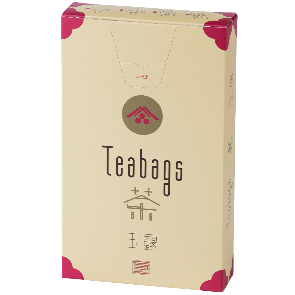 Sealed tall, cream box of 12 Ippodo Gyokuro One-Cup Teabags with pink corners and logo on bronze circle and easy open tab