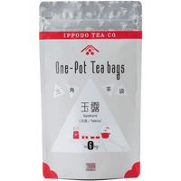 Grey and red sealed bag of Ippodo Gyokuro Japanese green tea one-pot teabags with preparation and serving utensils drawings