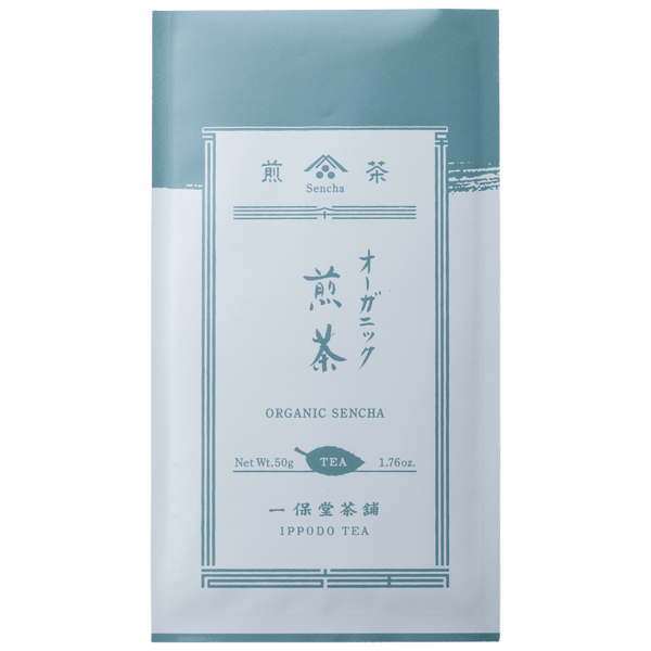 White and pale blue grey traditional packaging bag with Japanese characters for Ippodo Tea Co. Rimpo Organic Sencha green tea