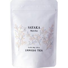 White resealable 100 gram bag of Ippodo Sayaka matcha with gold minimalist floral design