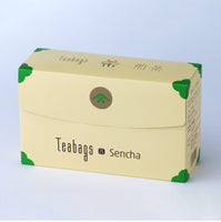 Sealed long beige box of 25 Japanese Sencha Teabags with green corners, easy open tab and Ippodo Tea logo on bronze circle