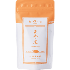 White packaging with orange faux-painted details for Shoike classic Japanese Sencha green tea 80g bag by Ippodo Tea Co.