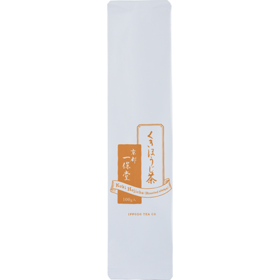 White and orange iconic packaging for Ippodo Tea Co. Stems Hojicha roasted green tea with Japanese writing and dashed lines 
