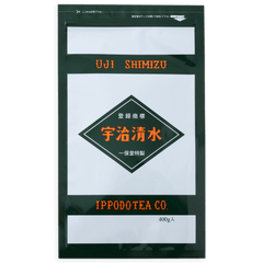 Grey and black large bag of Ippodo's Uji-Shimizu sweetened matcha tea powder with red font Japanese characters