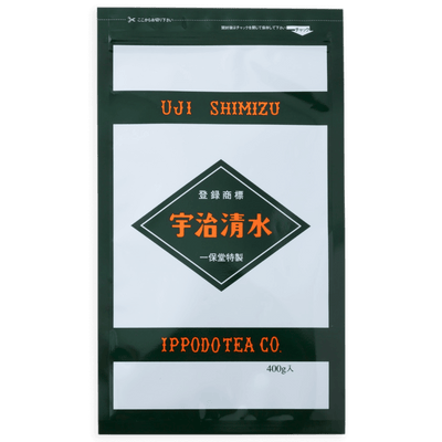 Grey and black large bag of Ippodo's Uji-Shimizu sweetened matcha tea powder with red font Japanese characters