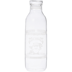A clear glass bottle with a narrow neck and wide body. It appears empty and has some etched or printed design on its surface, though the details aren't clearly visible. The bottle has a simple, cylindrical shape typical of water or juice bottles, with a slight lip at the top where a cap would typically be placed. The glass is transparent and clean.