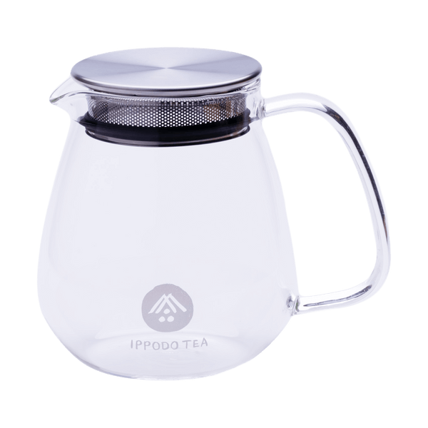 Transparent glass teapot with white "Ippodo Tea" and logo and lid insert with built-in circular mesh strainer