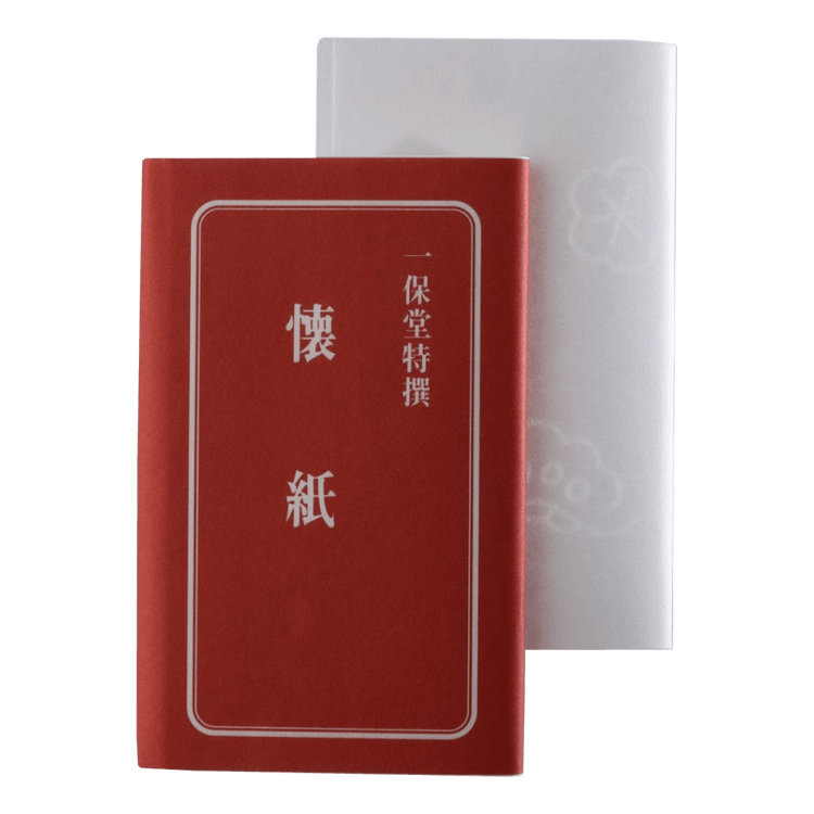 White paper tissues for tea ceremony sweets beside red Ippodo branded tissue cover labeled with Japanese kanji