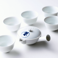 Collection of white artisan crafted Hasami-yaki Japanese porcelain with 5 teacups and one small kyusu teapot with blue seal