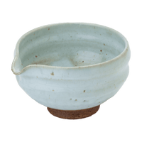 Artisan-made ceramic speckled white matcha tea bowl with hand groove and serving spout made from Mino-yaki Japanese clay