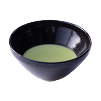 Sleek shiny cone shaped speckled black glazed ceramic matcha tea bowl with light green thin usucha matcha tea inside