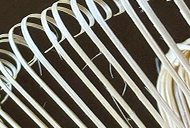 Close-up of curved chasen tines with fine, whisker-like bamboo fibers