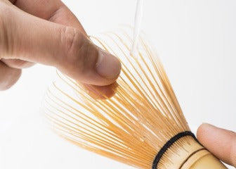 Holding and straightening tips of Korean artisan-made Chasen 80-tip bamboo matcha tea whisk utensil