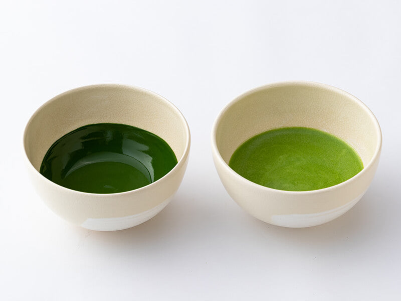 two tea bowls, one with usucha thin matcha and one with koicha thick matcha in it