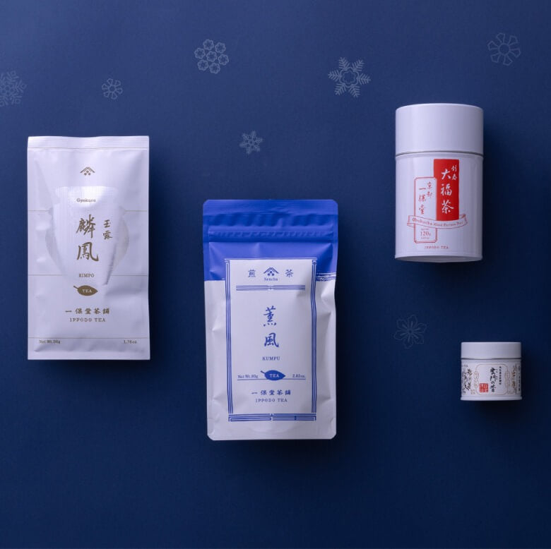 Selection of ippodo teas in packaging on a blue background with a snowflake motif.