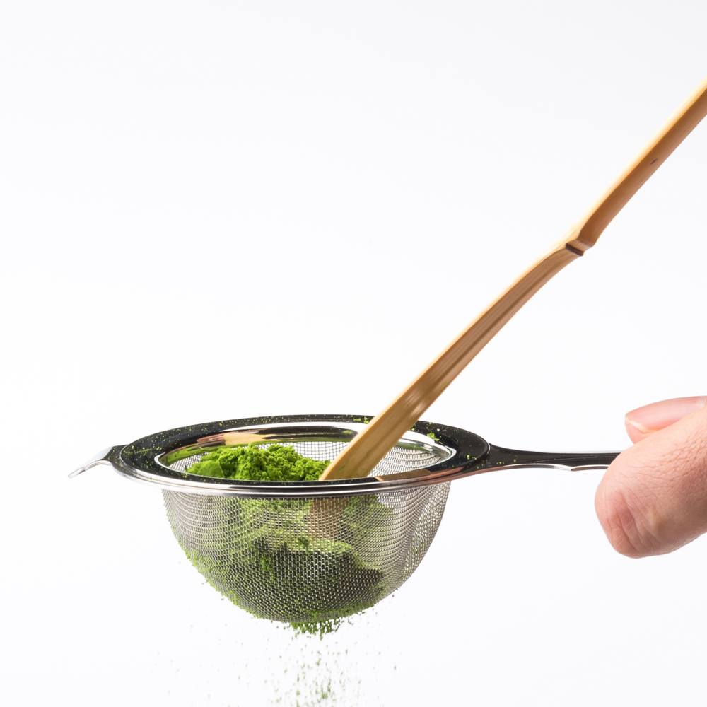 Enhance your experience by pressing matcha powder through this strainer before whisking.